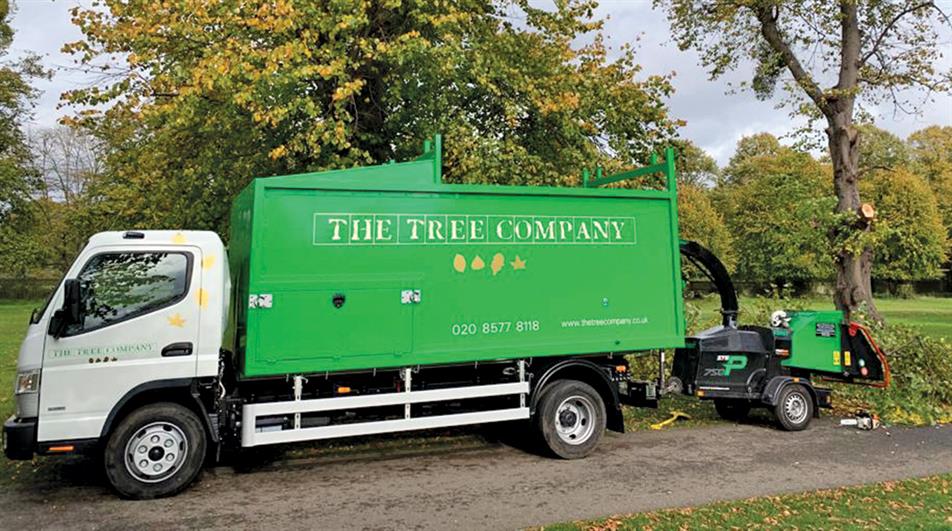 The Tree Company truck and woodchipper